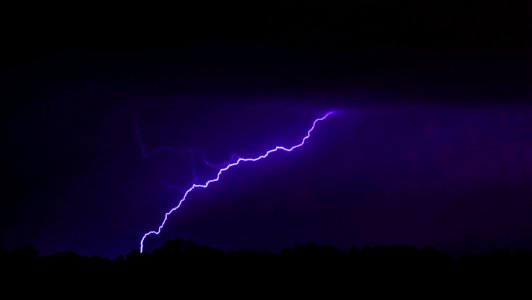 lightning striking mountain