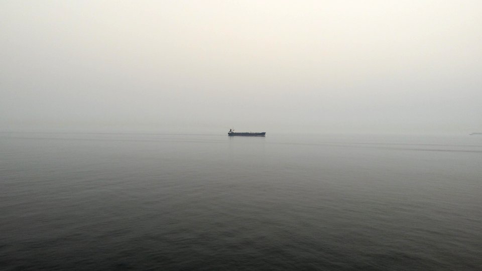 black boat on body of water photo