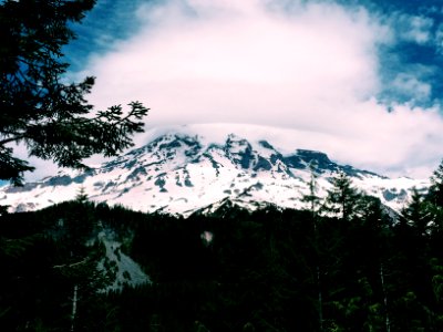 snow-covered mountain under white clouds photo