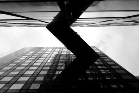 grayscale photo of worm's eye view of building photo