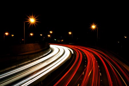 time-lapse photography of highway road at night photo