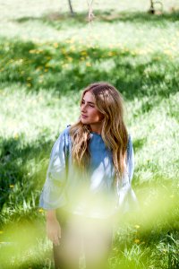 woman standing on grass field photo