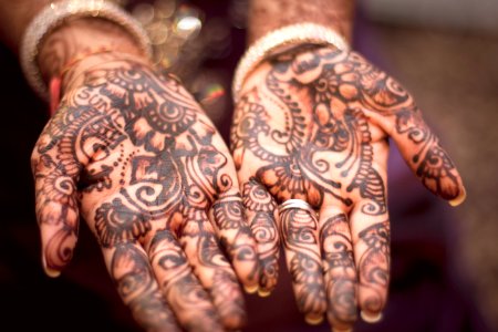 person showing hand tattoos photo