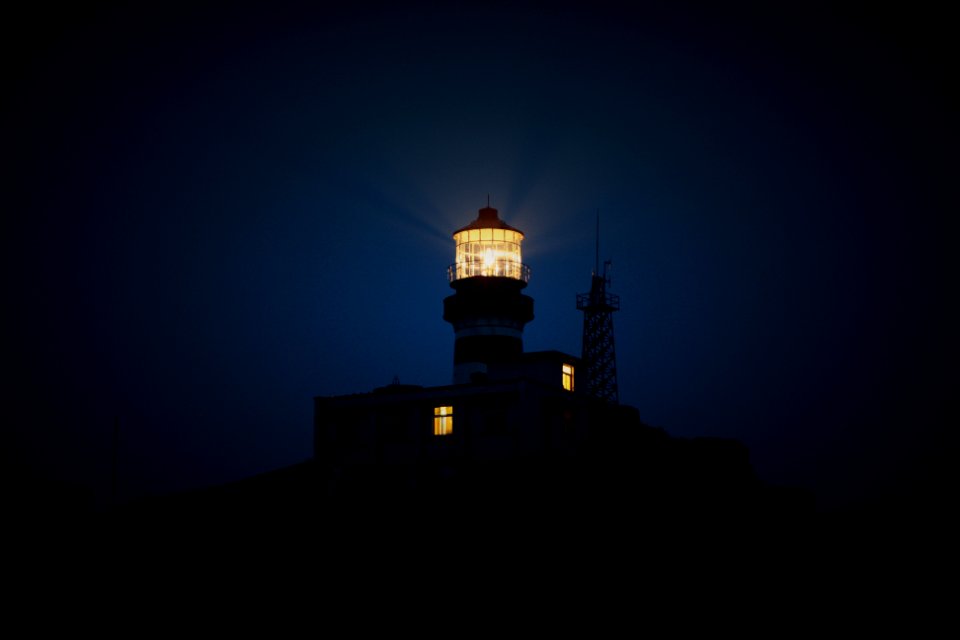 lighthouse during night time