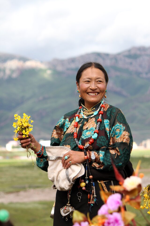 Tibet ethnic hand holding flowers ms
