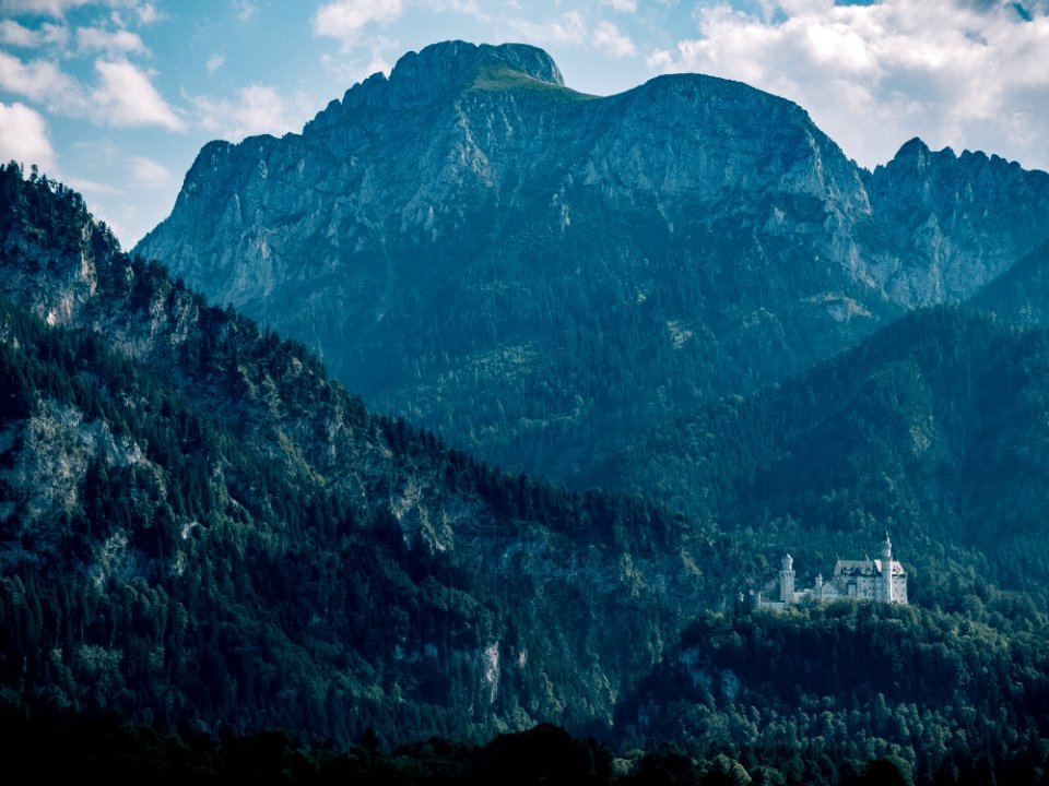 white castle and mountains at daytime