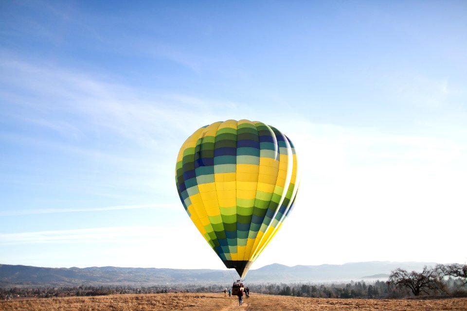 yellow and blue hot air balloon at the ground