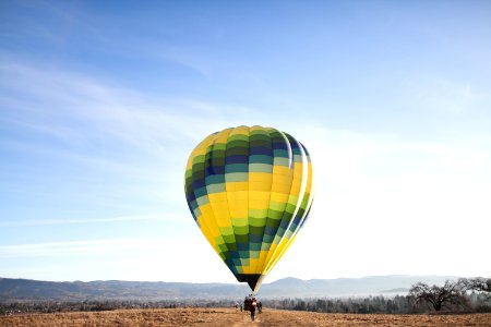 yellow and blue hot air balloon at the ground