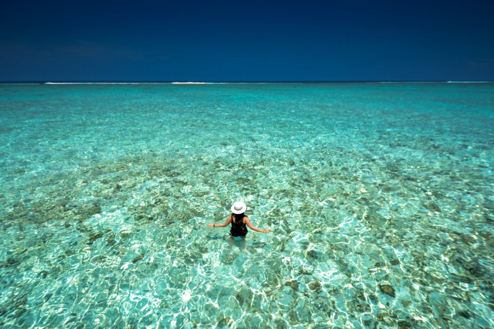 woman in body of water in birds eye photography