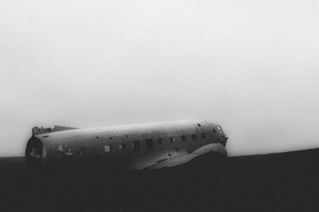 grayscale photo of wrecked plane photo