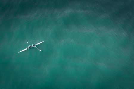 white canoe on body of water