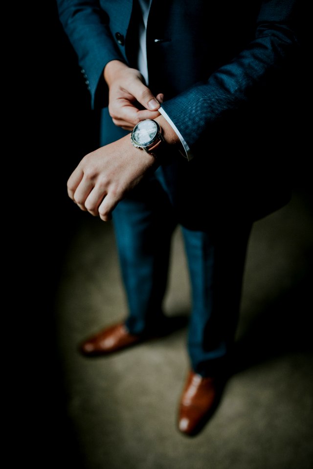 man holding his black suit