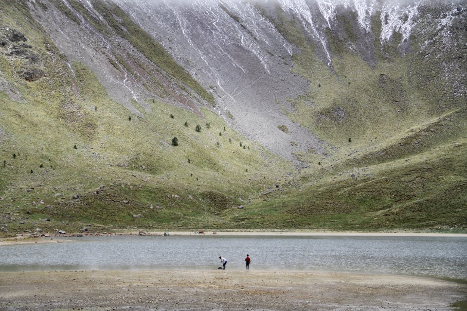 person standing beside river