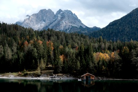 body of water in front of mountain during daytime photo