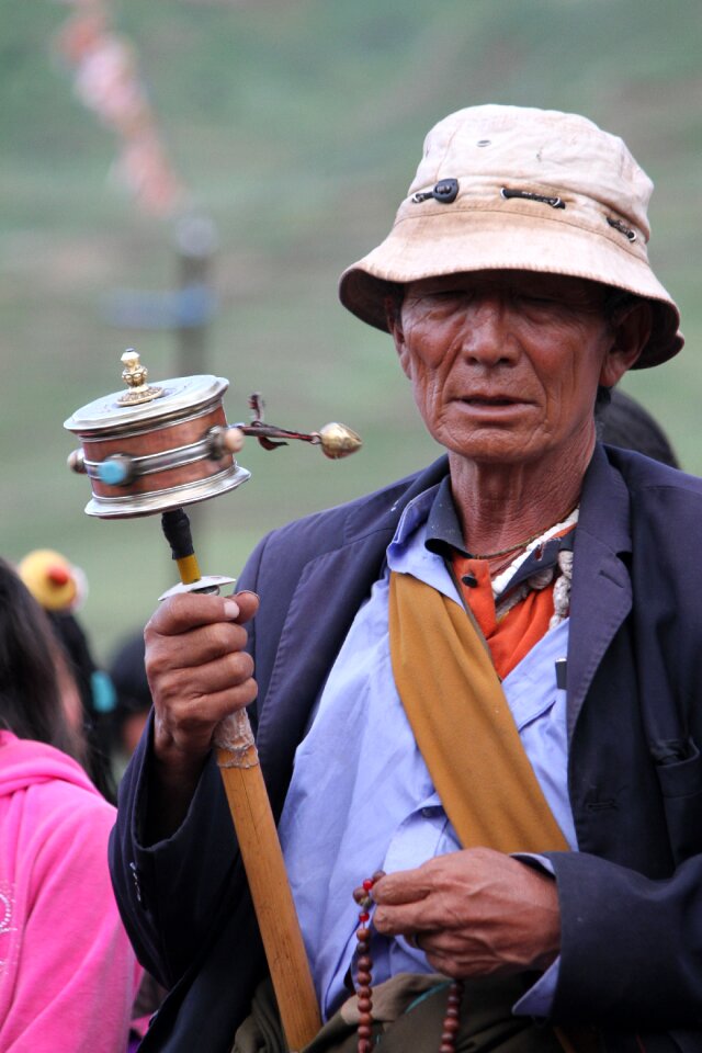 Character turning the wheel tibet ethnic
