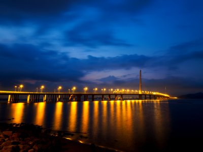 lighted sea bridge above water photo
