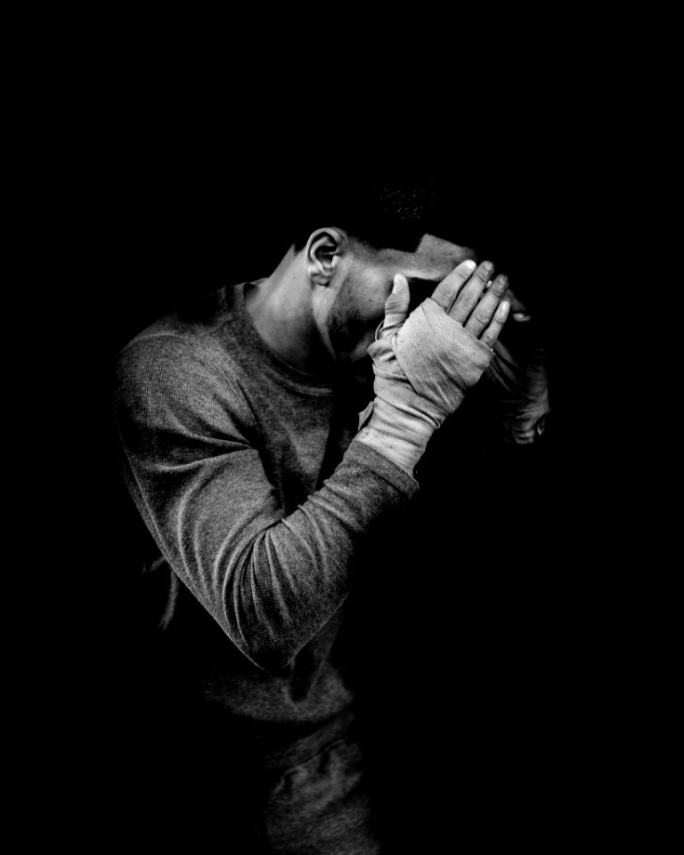 grayscale photo of male boxer