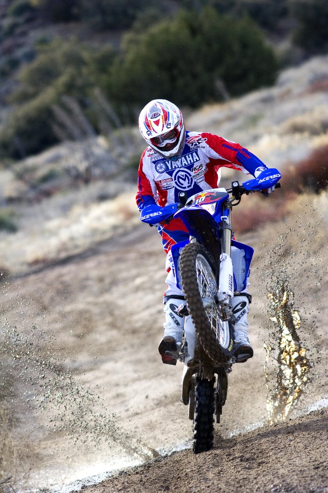 man riding of dirt bike photo