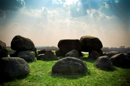 stone formation at the green grass field photo