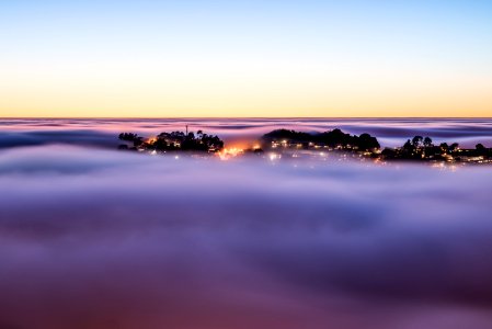 The foggy sunrise over Twin Peaks in San Francisco photo