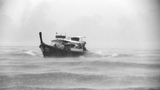 grayscaled photo of boat photo