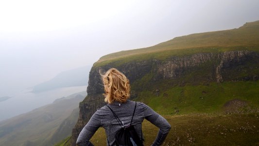 woman standing near cliff photo
