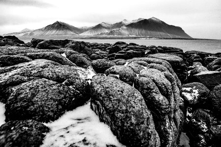 Volcanic rock sea mountains photo