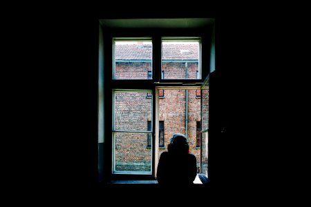person standing in front of open window