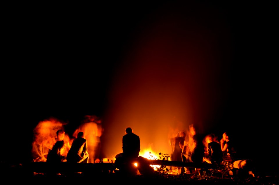 people gathered around camp fire at nighttime