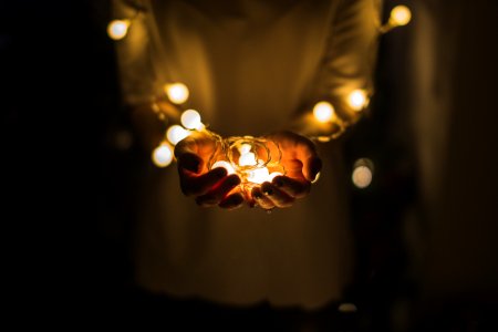 person holding string lights photo