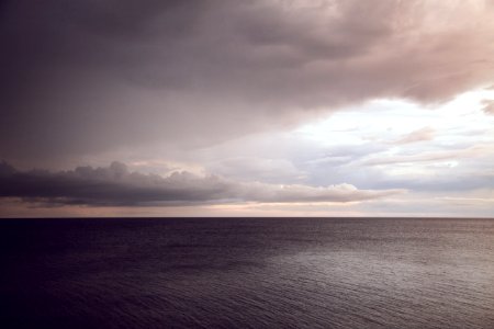 boy of water under comulus clouds
