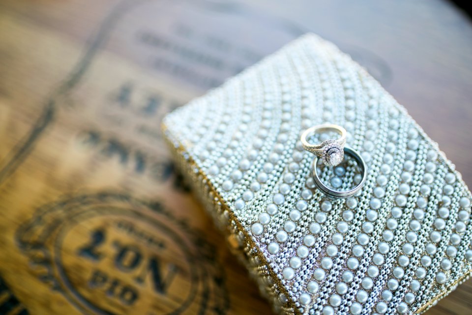 silver ring on white textile
