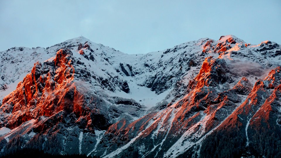 photo of mountain covered of snow during cloudy sky photo