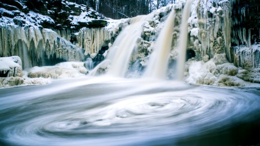 timelapse photography of waterfalls with melted snow photo