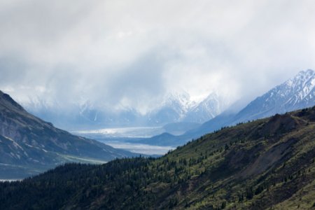 snow-covered mountains under cloudy sky photo