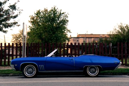 blue convertible coupe on street during daytime photo