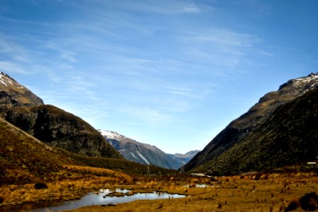 body of water near mountains photo