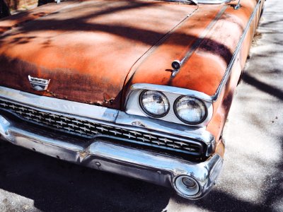 vintage orange car during daytime photo