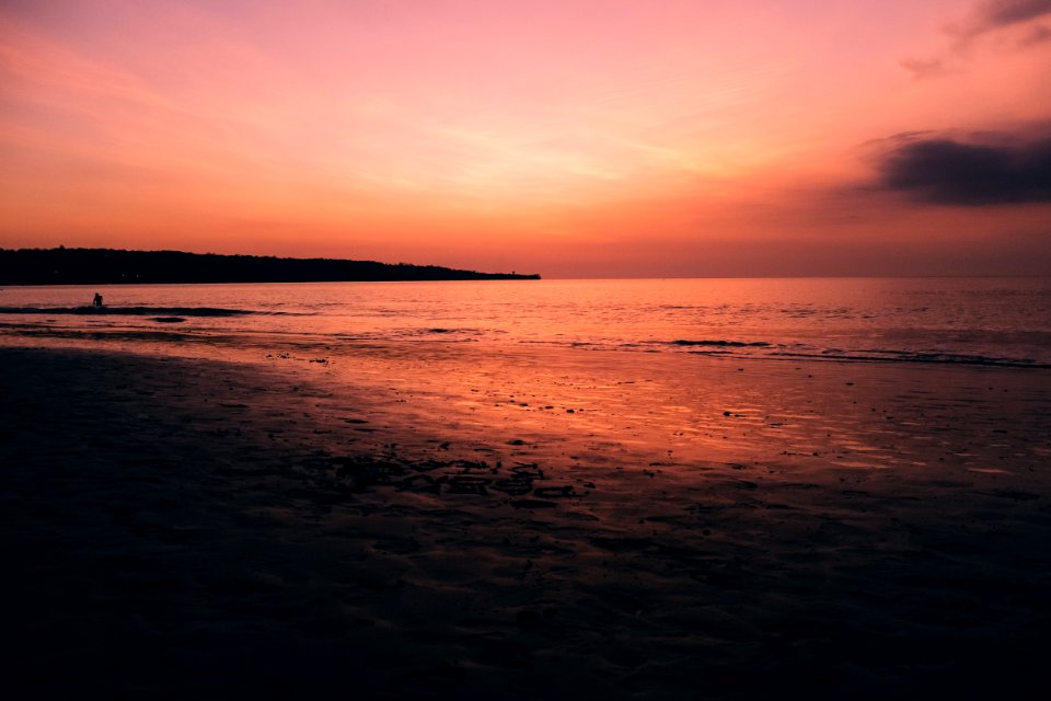 body of water during golden hour photo