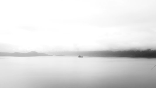 grayscale photo of a body of water photo