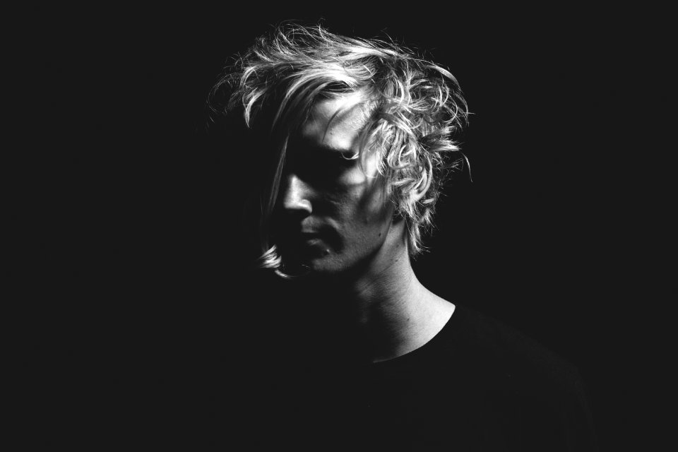 man in black T-shirt in grayscale photography