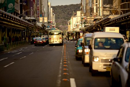 cars and bus stop in front of traffic lights photo