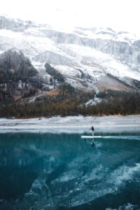 person doing paddle board