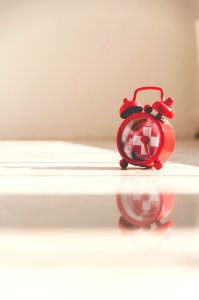 red twin bell alarm clock photo