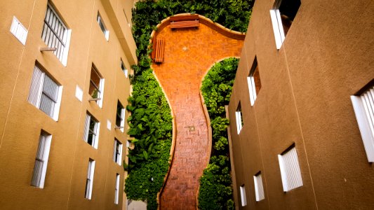 tiled pathway between buildings