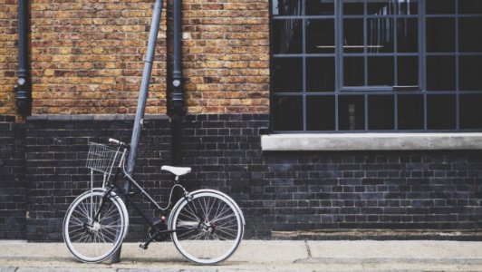 gray and black city bike on street photo