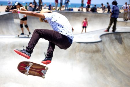 people playing skateboard on skateboard park photo