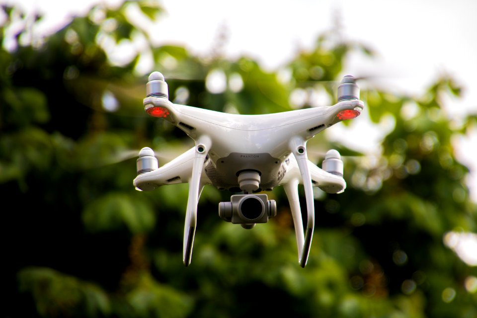 white and gray quadcopter drone