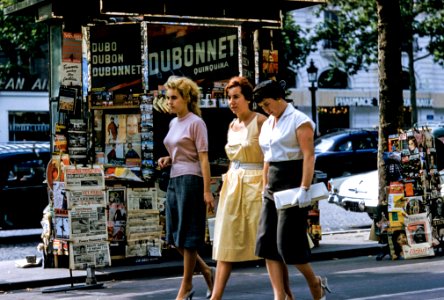 three women walking on road photo