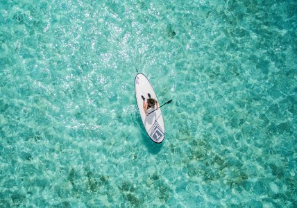 aerial photo of person using paddleboard photo